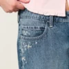 Baggy-Jeans mit niedriger Leibhöhe, dunkler Waschung und Blumenstickerei Baggy-Jeans mit niedriger Leibhöhe, dunkler Waschung und Blumenstickerei
