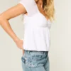 Baggy-Jeans mit niedriger Leibhöhe, mittlerer Waschung und Schmetterlingsmotiv Baggy-Jeans mit niedriger Leibhöhe, mittlerer Waschung und Schmetterlingsmotiv
