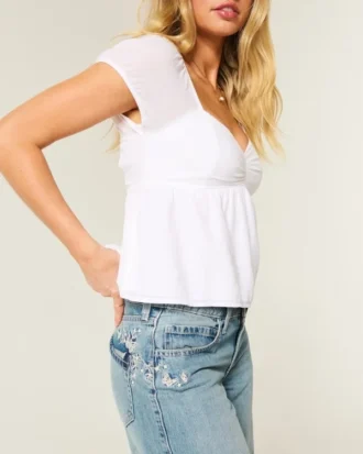 Baggy-Jeans mit niedriger Leibhöhe, mittlerer Waschung und Schmetterlingsmotiv