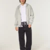 Gewaschene schwarze Baggy-Jeans mit Drachenmotiv