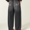 Gewaschene schwarze Baggy-Jeans mit Grafik Gewaschene schwarze Baggy-Jeans mit Grafik