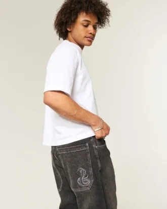 Gewaschene schwarze Baggy-Jeans mit Schlangenstickerei
