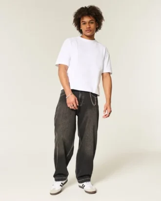 Gewaschene schwarze Baggy-Jeans mit Schlangenstickerei