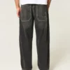 Gewaschene schwarze Baggy-Jeans mit Schlangenstickerei Gewaschene schwarze Baggy-Jeans mit Schlangenstickerei