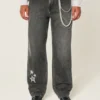Gewaschene schwarze Baggy-Jeans mit Stern-Grafik