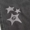 Gewaschene schwarze Baggy-Jeans mit Stern-Grafik