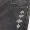 Gewaschene schwarze Skater-Baggy-Jeans mit Spielkarten-Joker-Grafik