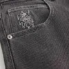Gewaschene schwarze Skater-Baggy-Jeans mit Spielkarten-Joker-Grafik