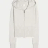 Gilly Hicks Sweatshirt mit Zip-Up-Kapuze und gewelltem Saum Gilly Hicks Sweatshirt mit Zip-Up-Kapuze und gewelltem Saum