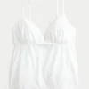 Glitzerndes Babydoll-Oberteil mit Stickerei Glitzerndes Babydoll-Oberteil mit Stickerei