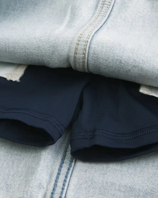 Hellblau gewaschene Mini-Skort aus Denim mit Schnürung Hellblau gewaschene Mini-Skort aus Denim mit Schnürung