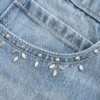 Hellblau gewaschene Mini-Skort mit Nieten