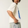 Hellblaue Baggy-Jeans mit gesticktem Würfel-Motiv Hellblaue Baggy-Jeans mit gesticktem Würfel-Motiv