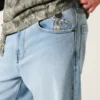 Hellblaue Super-Baggy-Jeans mit Astronauten-Grafik Hellblaue Super-Baggy-Jeans mit Astronauten-Grafik