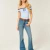 Hoch geschnittene Flare-Jeans in mittlerer Waschung Hoch geschnittene Flare-Jeans in mittlerer Waschung