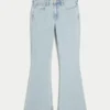 Hoch geschnittene, hell gewaschene Flare-Jeans mit Herzstickerei Hoch geschnittene, hell gewaschene Flare-Jeans mit Herzstickerei