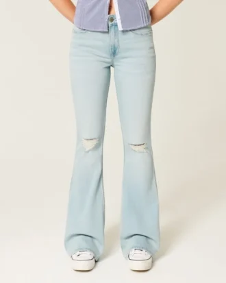 Hoch geschnittene, leicht verwaschene Flare-Jeans mit Rissen