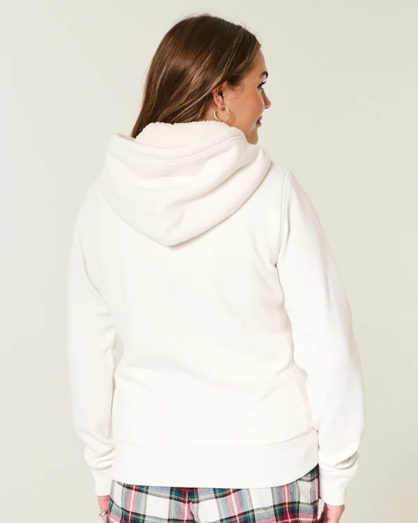 Holiday Vault Release Sherpa-gefütterter Hoodie mit Reißverschluss und Logo-Grafik Holiday Vault Release Sherpa-gefütterter Hoodie mit Reißverschluss und Logo-Grafik