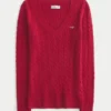 Ikonischer Pullover mit V-Ausschnitt und Zopfmuster