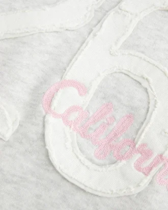Kapuzenpullover mit Kunstfellfutter und Grafik