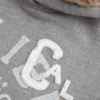 Kapuzenpullover mit Kunstfellfutter und Grafik