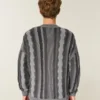 Kastiger gestreifter Pullover mit Rundhalsausschnitt Kastiger gestreifter Pullover mit Rundhalsausschnitt