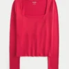 Langärmliges Baby-T-Shirt aus nahtlosem Stoff mit quadratischem Ausschnitt Langärmliges Baby-T-Shirt aus nahtlosem Stoff mit quadratischem Ausschnitt