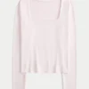 Langärmliges Baby-T-Shirt aus nahtlosem Stoff mit quadratischem Ausschnitt Langärmliges Baby-T-Shirt aus nahtlosem Stoff mit quadratischem Ausschnitt