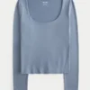 Langärmliges Baby-T-Shirt aus nahtlosem Stoff mit Rundhalsausschnitt Langärmliges Baby-T-Shirt aus nahtlosem Stoff mit Rundhalsausschnitt