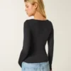 Langärmliges Baby-T-Shirt aus nahtlosem Stoff mit Rundhalsausschnitt Langärmliges Baby-T-Shirt aus nahtlosem Stoff mit Rundhalsausschnitt