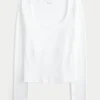 Langärmliges Baby-T-Shirt aus nahtlosem Stoff mit Rundhalsausschnitt Langärmliges Baby-T-Shirt aus nahtlosem Stoff mit Rundhalsausschnitt