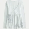 Langärmliges Babydoll-Oberteil mit Grafikprint und gerafftem Brustbereich