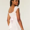 Leichtes Babydoll-Oberteil aus Satin mit Bindeband Leichtes Babydoll-Oberteil aus Satin mit Bindeband
