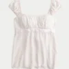 Leichtes Babydoll-Oberteil aus Satin mit Bindeband Leichtes Babydoll-Oberteil aus Satin mit Bindeband
