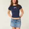Mini-Jeansrock mit niedriger Taille und gestickter Schleife Mini-Jeansrock mit niedriger Taille und gestickter Schleife