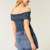 Mini-Skort aus Denim mit niedriger Leibhöhe, mittlerer Waschung und Flaggenstickerei Mini-Skort aus Denim mit niedriger Leibhöhe, mittlerer Waschung und Flaggenstickerei