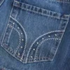 Mini-Skort aus Denim mit niedriger Leibhöhe und Nieten Mini-Skort aus Denim mit niedriger Leibhöhe und Nieten