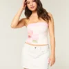 Mini-Skort aus weißem Denim mit niedriger Leibhöhe Mini-Skort aus weißem Denim mit niedriger Leibhöhe