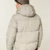 Mit Kunstfell gefütterte Daunenjacke