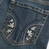 Niedrig geschnittene, dunkel gewaschene Bootcut-Jeans mit Stickerei