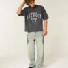 Schweres, baggy geschnittenes Detroit Graphic Football T-Shirt Schweres, baggy geschnittenes Detroit Graphic Football T-Shirt
