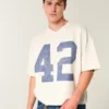 Schweres, baggy geschnittenes, kurzes Football-T-Shirt mit Grafikprint Schweres, baggy geschnittenes, kurzes Football-T-Shirt mit Grafikprint