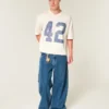 Schweres, baggy geschnittenes, kurzes Football-T-Shirt mit Grafikprint Schweres, baggy geschnittenes, kurzes Football-T-Shirt mit Grafikprint