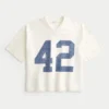 Schweres, baggy geschnittenes, kurzes Football-T-Shirt mit Grafikprint Schweres, baggy geschnittenes, kurzes Football-T-Shirt mit Grafikprint