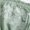 Trägerloses, besticktes Babydoll-Kleid Trägerloses, besticktes Babydoll-Kleid
