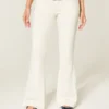 Ultra-niedrige weiße Jeans mit gestickter Tasche und ausgestelltem Bein Ultra-niedrige weiße Jeans mit gestickter Tasche und ausgestelltem Bein